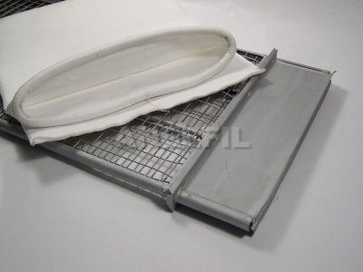 Envelope shaped filter bag with rubber ribbon holding, next to its wire cage.